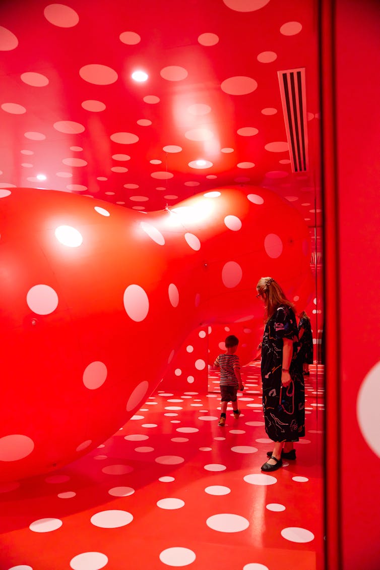 A red room filled with white polka dots.