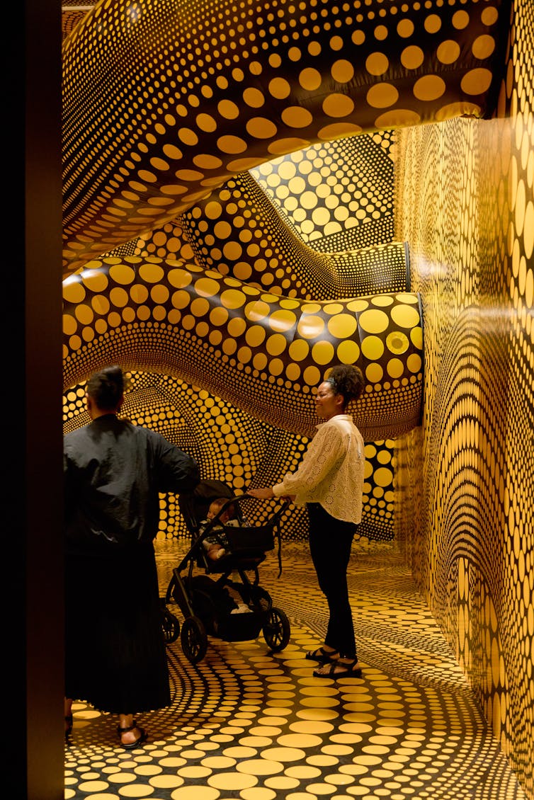 Black tentacles with yellow polka-dots.