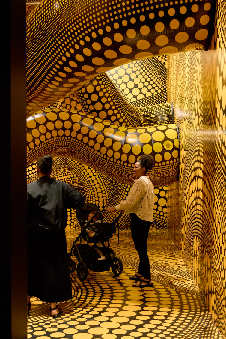 Black tentacles with yellow polka-dots.