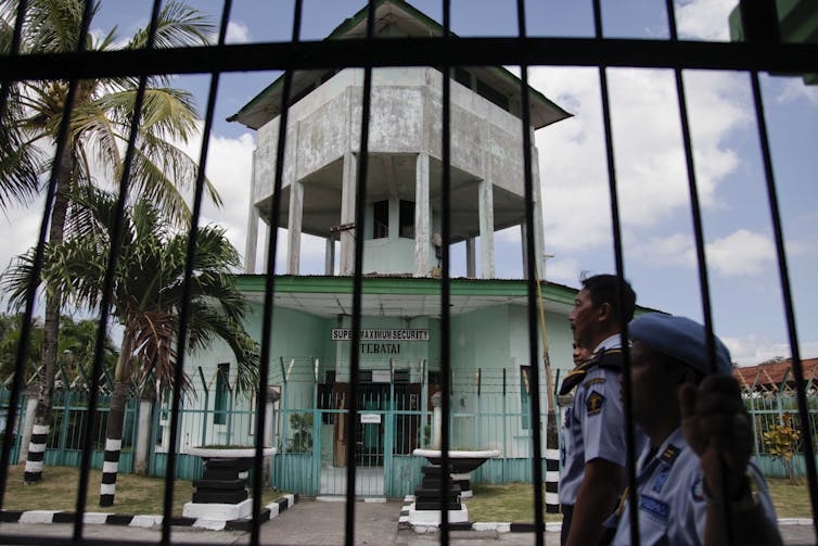 Kerobokan Prison in Bali, seen behind a black fence.