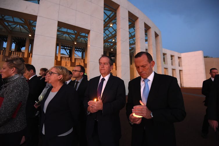 Tony Abbott at a candlelight vigil.