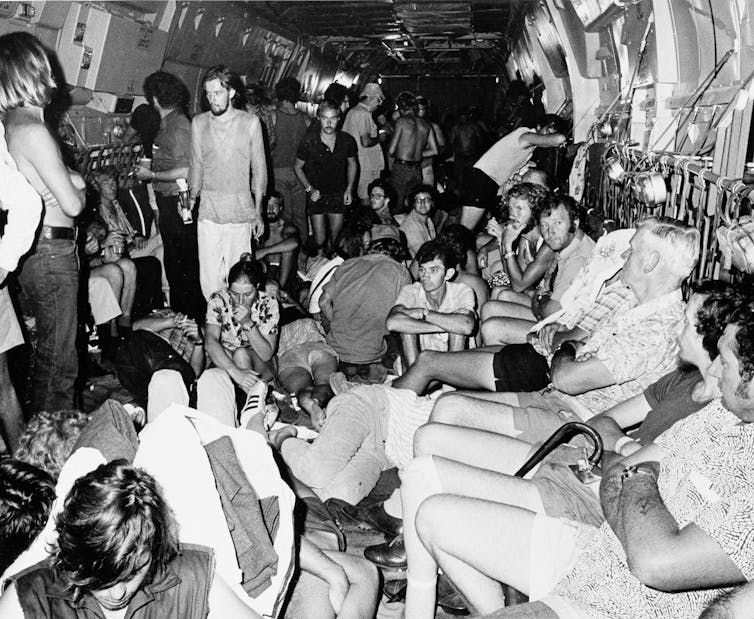 people crammed into a plane