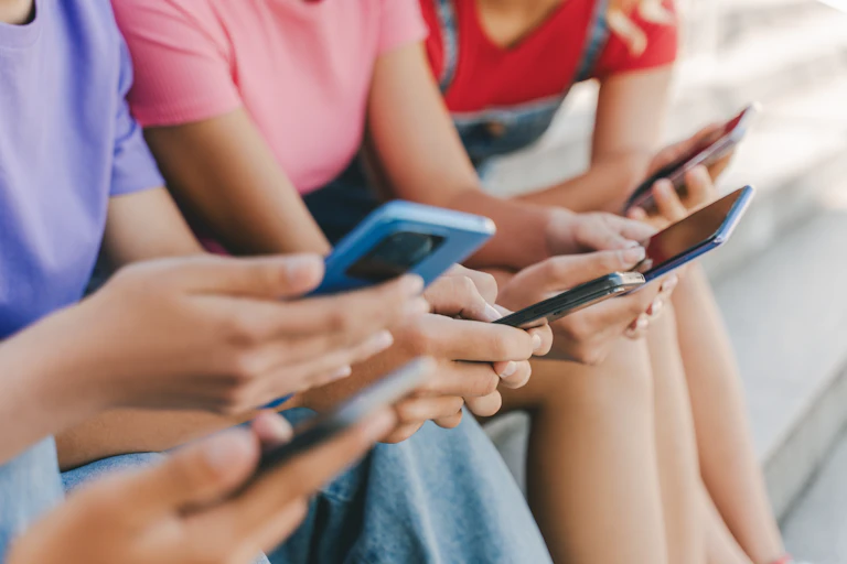 close up on youth using smartphones