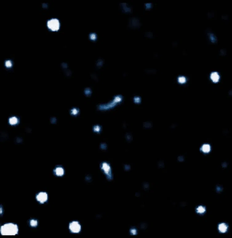 Animation of white circles moving through black space.