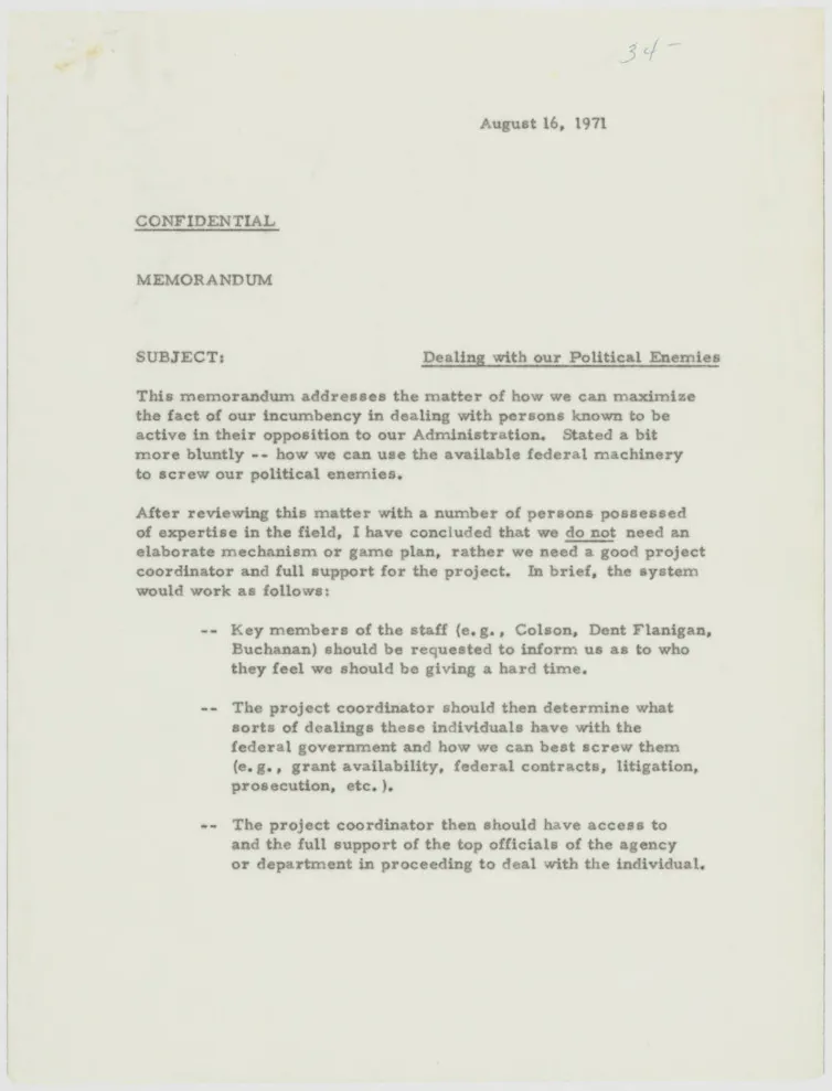 A beige piece of paper with typing on it that includes 'SUBJECT: Dealing with our Political Enemies.'