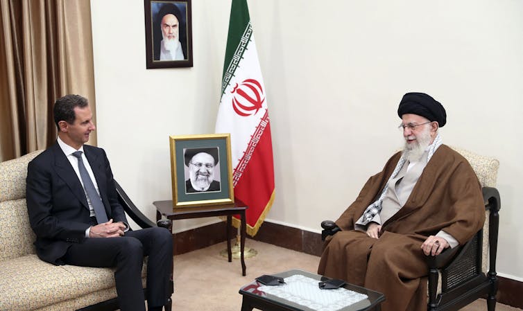 Iranian Supreme Leader Ayatollah Ali Khamenei speaks with Syrian President Bashar al-Assad.