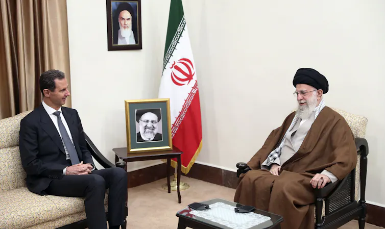 Iranian Supreme Leader Ayatollah Ali Khamenei speaks with Syrian President Bashar al-Assad.