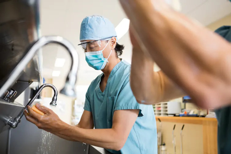 Surgeons scrub in