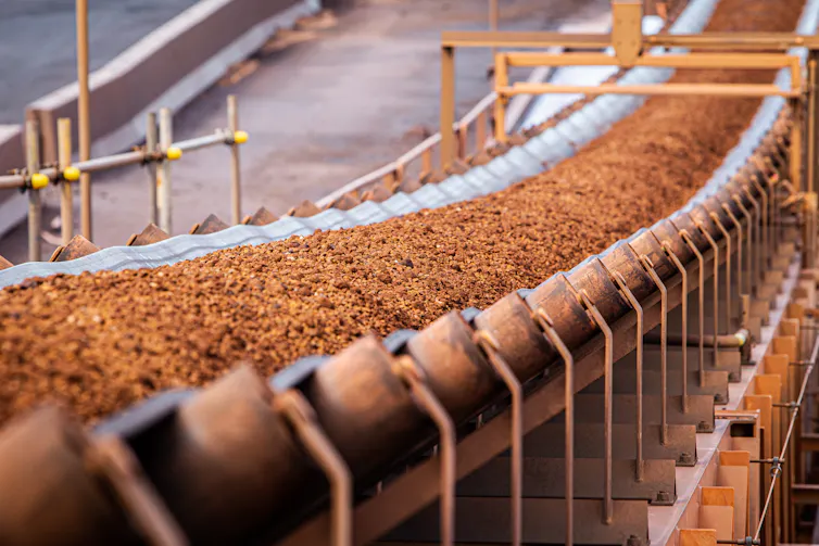 Conveyor belt moving iron ore