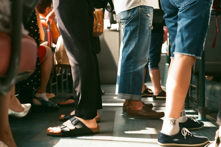 Feet on a bus.