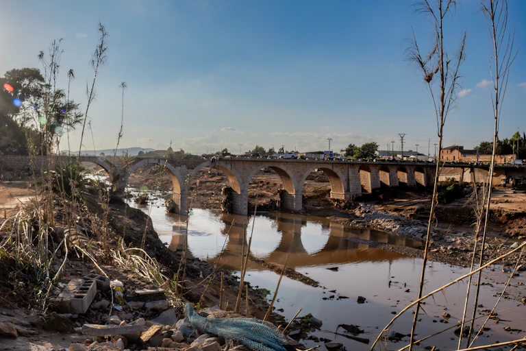 Devastation surrounding a bridge in Valencia.