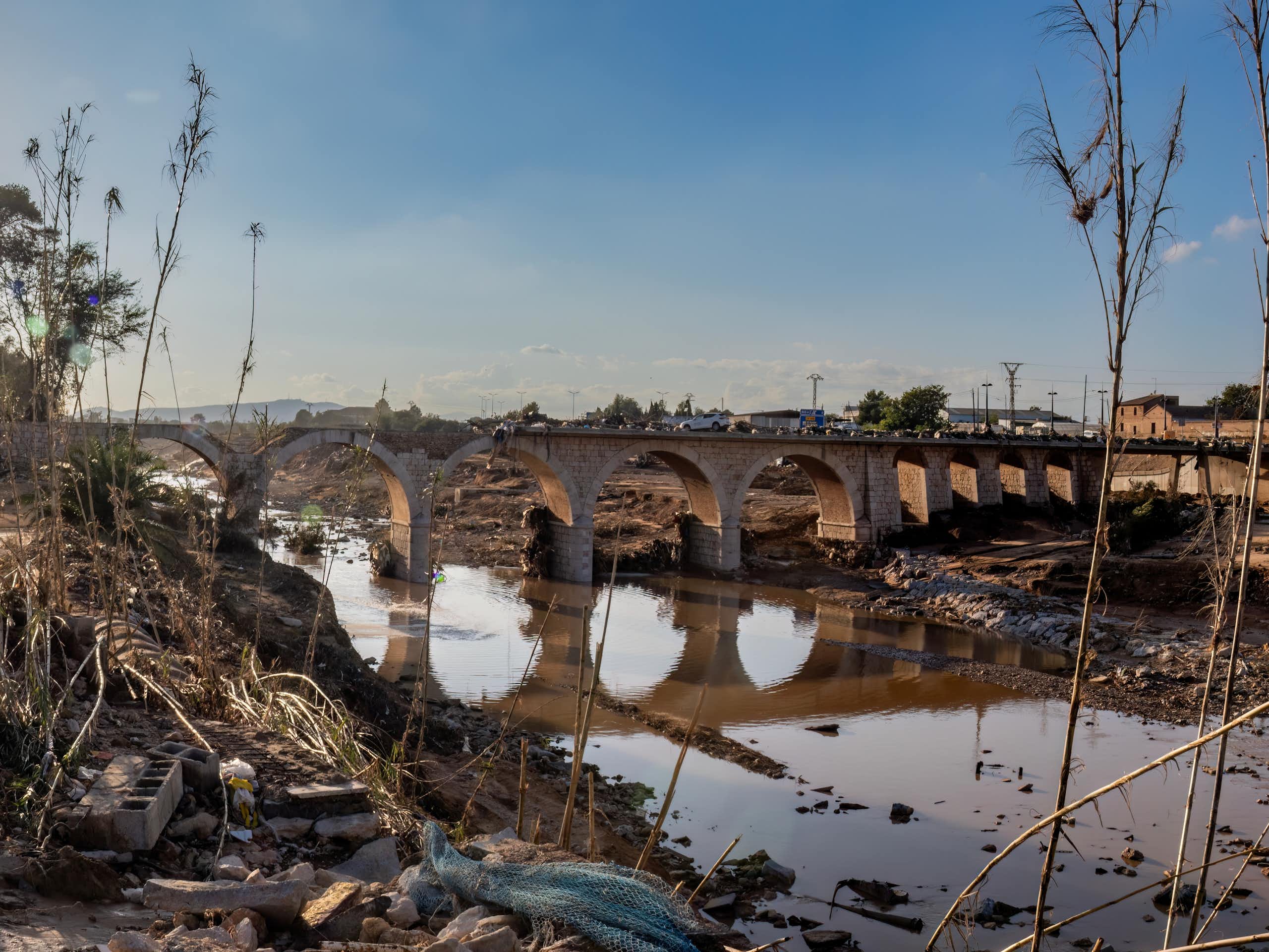 Devastation surrounding a bridge in Valencia.