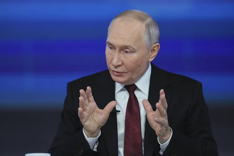 Russian president Vladimir Putin, gestures with his hands at a press conference in Moscow, December 19 2024.