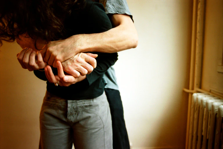 A person restraining another person