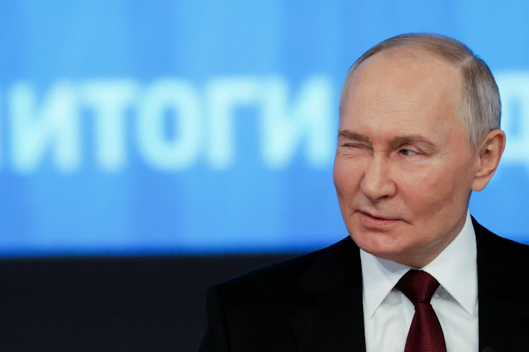 Vladimir Putin winking.