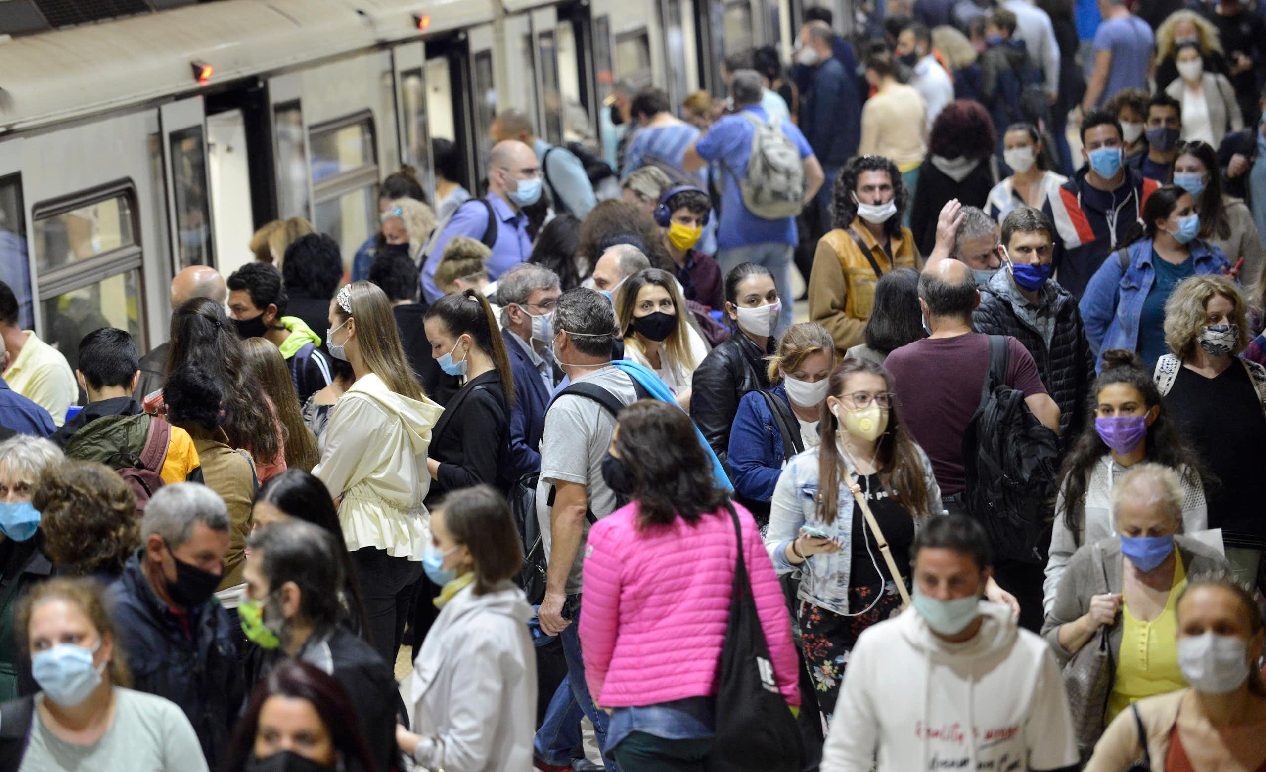 A crowd of masked people on a station platform in Sofia, Bulgaria.