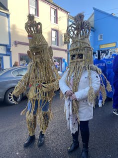 People in traditional straw suits on Wren's day in Dingle.