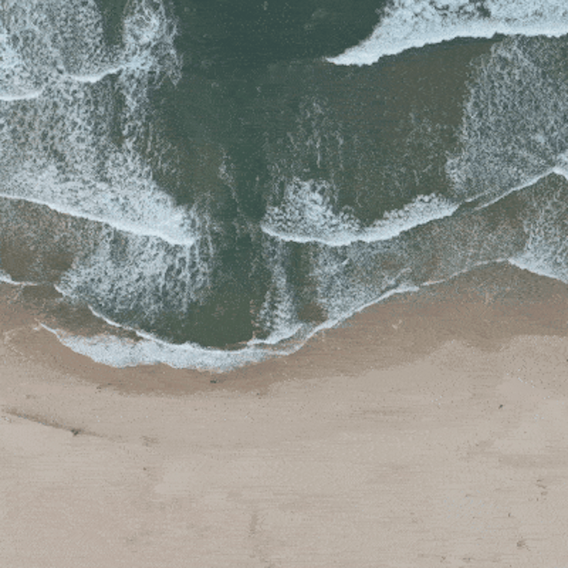Aerial shot of a beach with waves