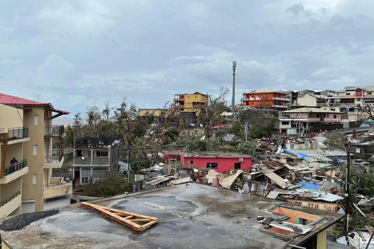 view of damaged buildings, lots of debris across Mayotte after cyclone hit