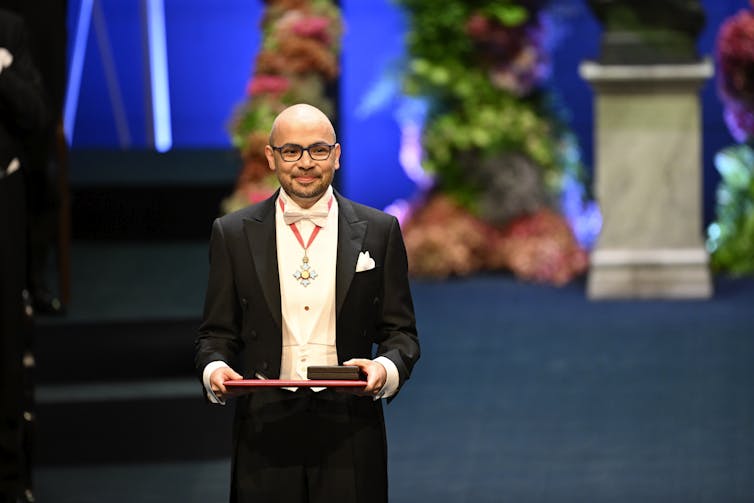 Demis Hassabis, CEO of DeepMind, receives his Nobel medal at a ceremony in Stockholm.