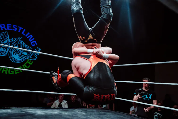 Wrestlers in the ring.