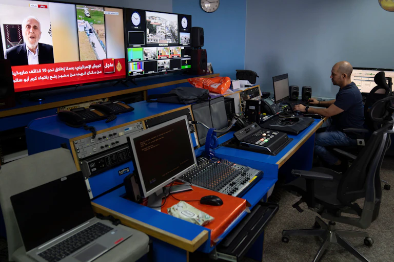 People working at terminals in Al Jazeera's Ramallah office.