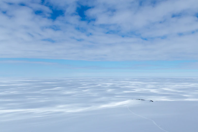 Ice sheet stretching off into the horizon on sunny day