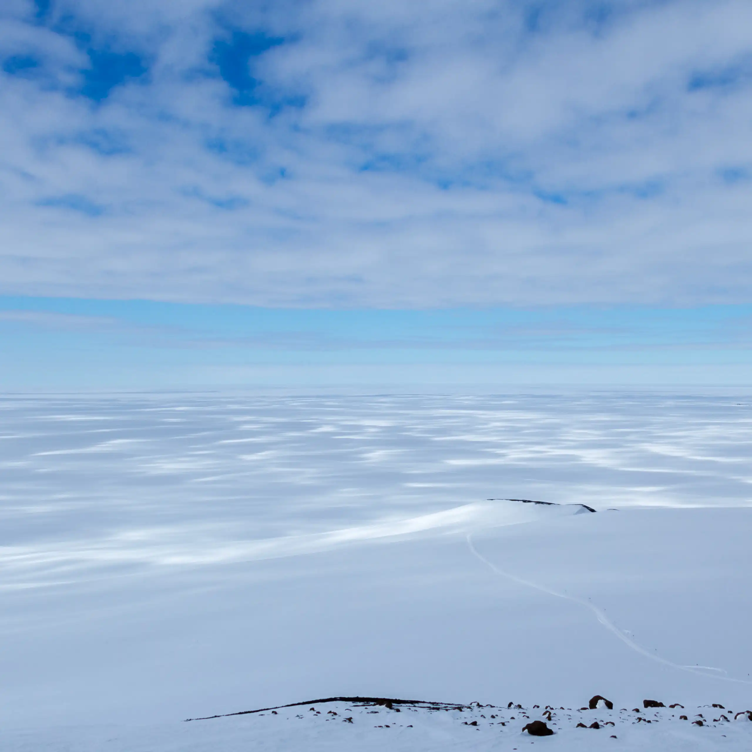 Ice sheet stretching off into the horizon on sunny day