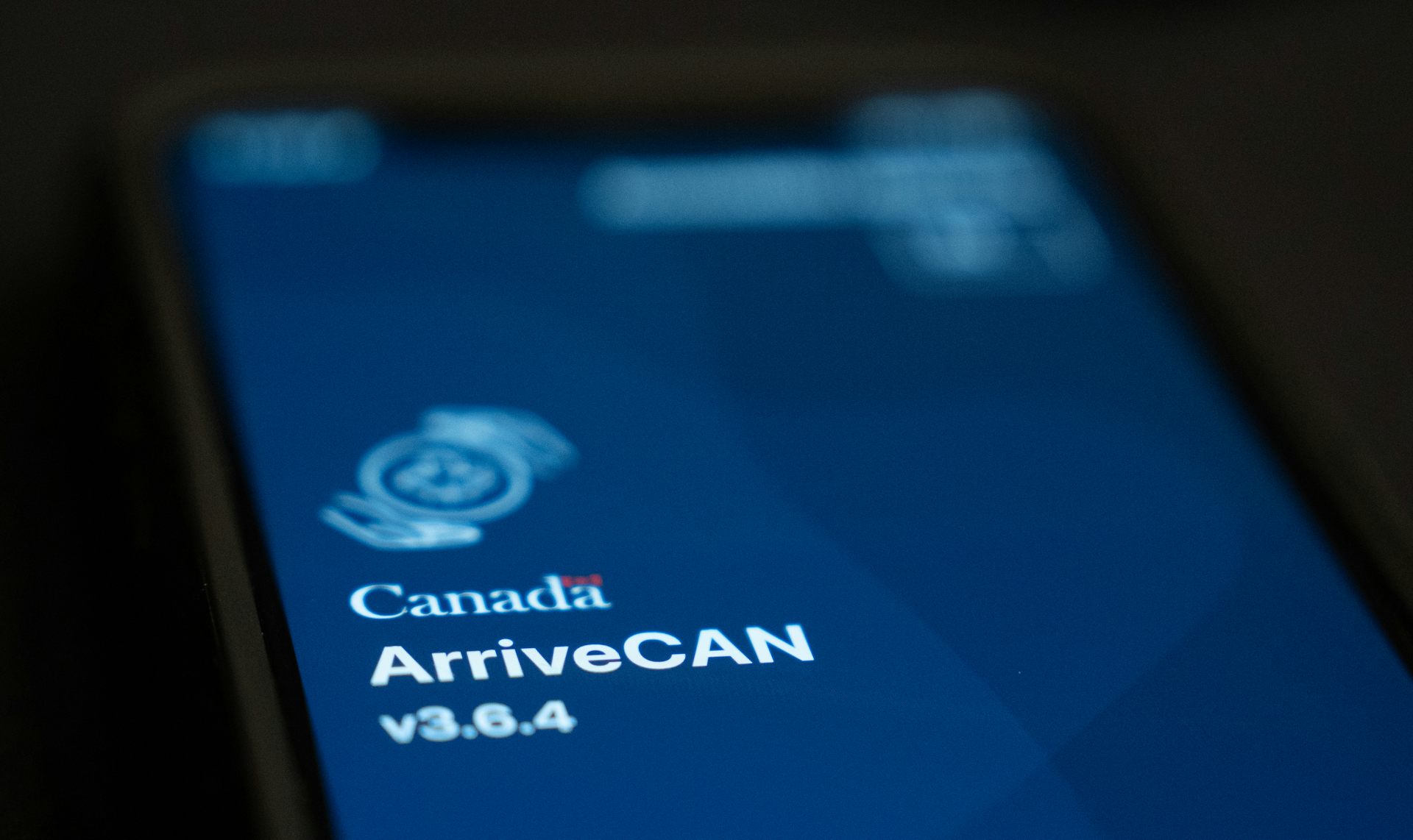 A mobile screen displays the ArriveCAN app.