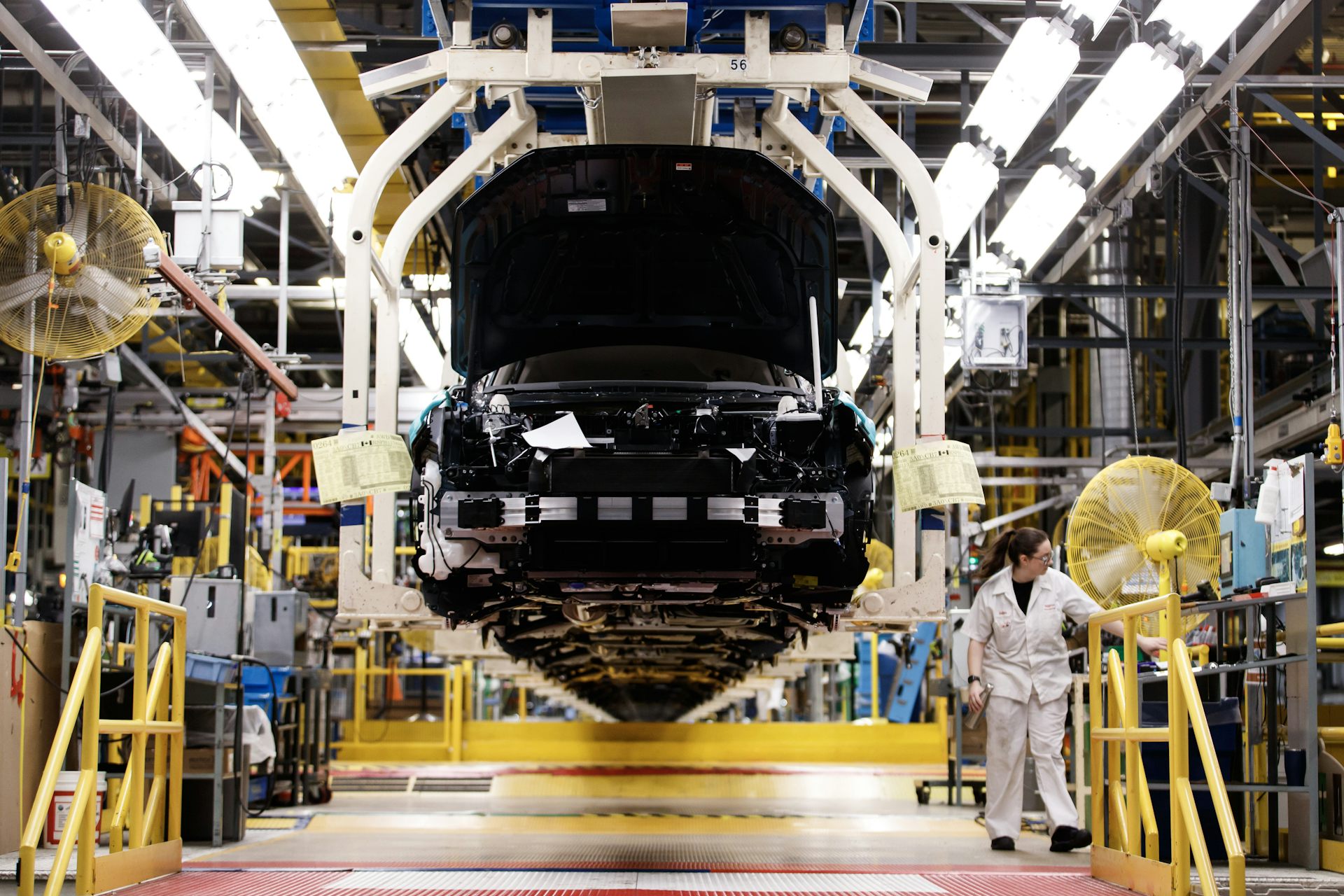 People work on a production line at a Honda plant.