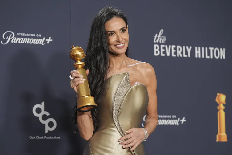 Moore with her award.