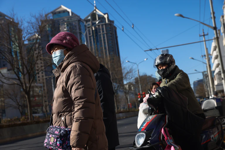 People in the street in Beijing.