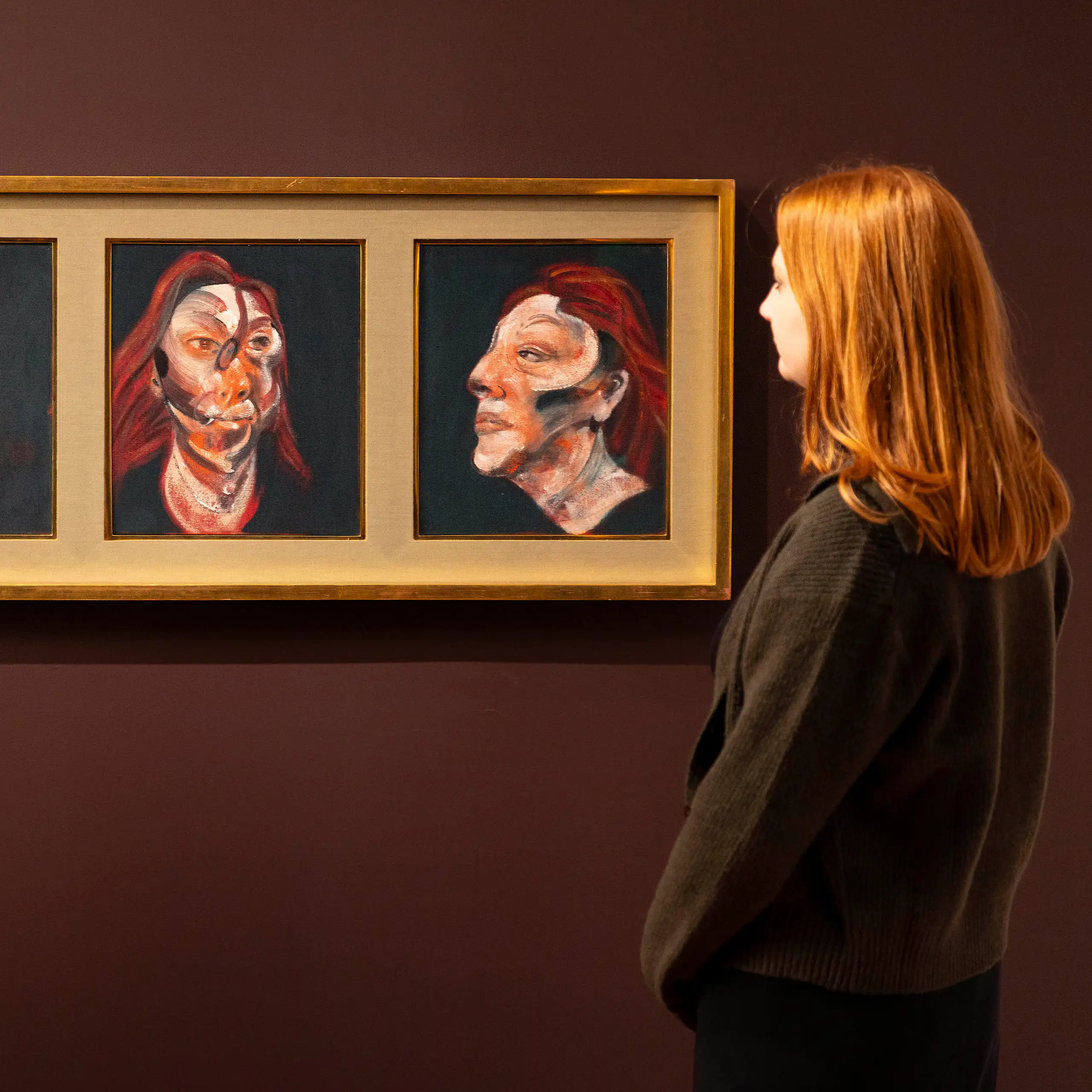 Three Studies for Portrait of Isabel Rawsthorne on the wall of a gallery, with two women looking on.