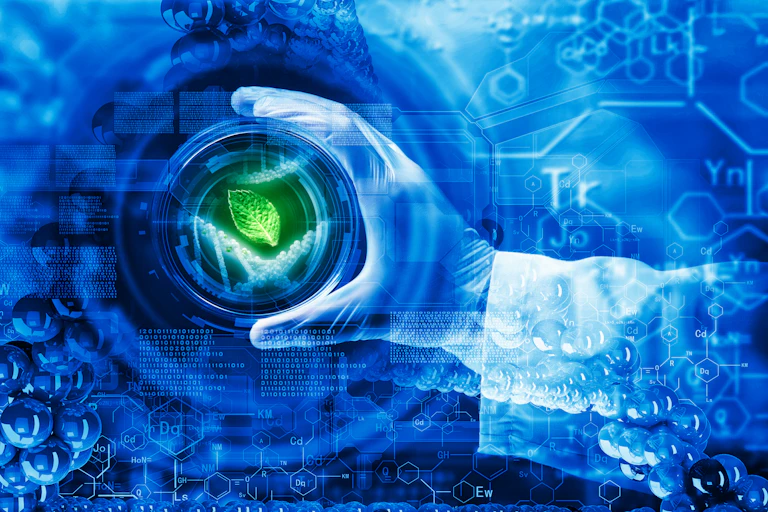 Hand in blue glove frames a green leaf