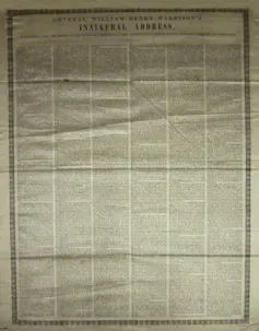 A large ivory piece of silk with black printing on it.
