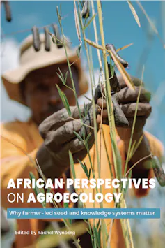 A photo of the book cover depicting a man in a straw hat working with seeds on a crop