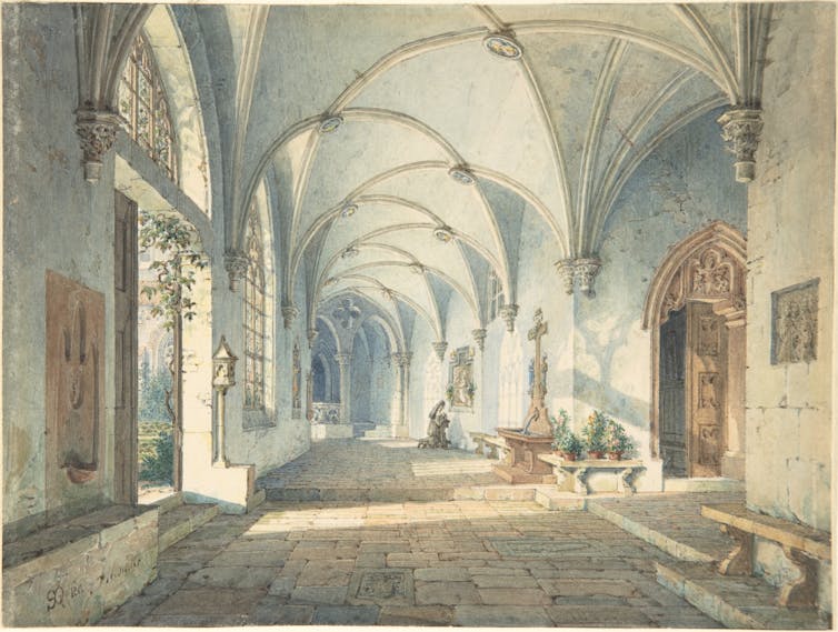 A large hall; a nun prays.