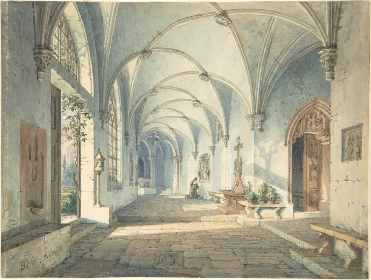 A large hall; a nun prays.