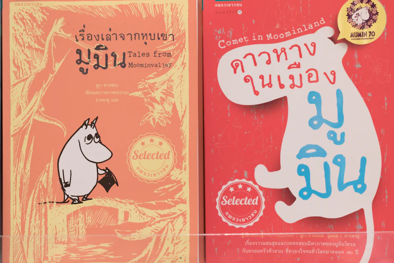 A Moomin children's book cover with the title in Thai.