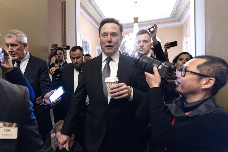 Elon Musk in front of reporters.