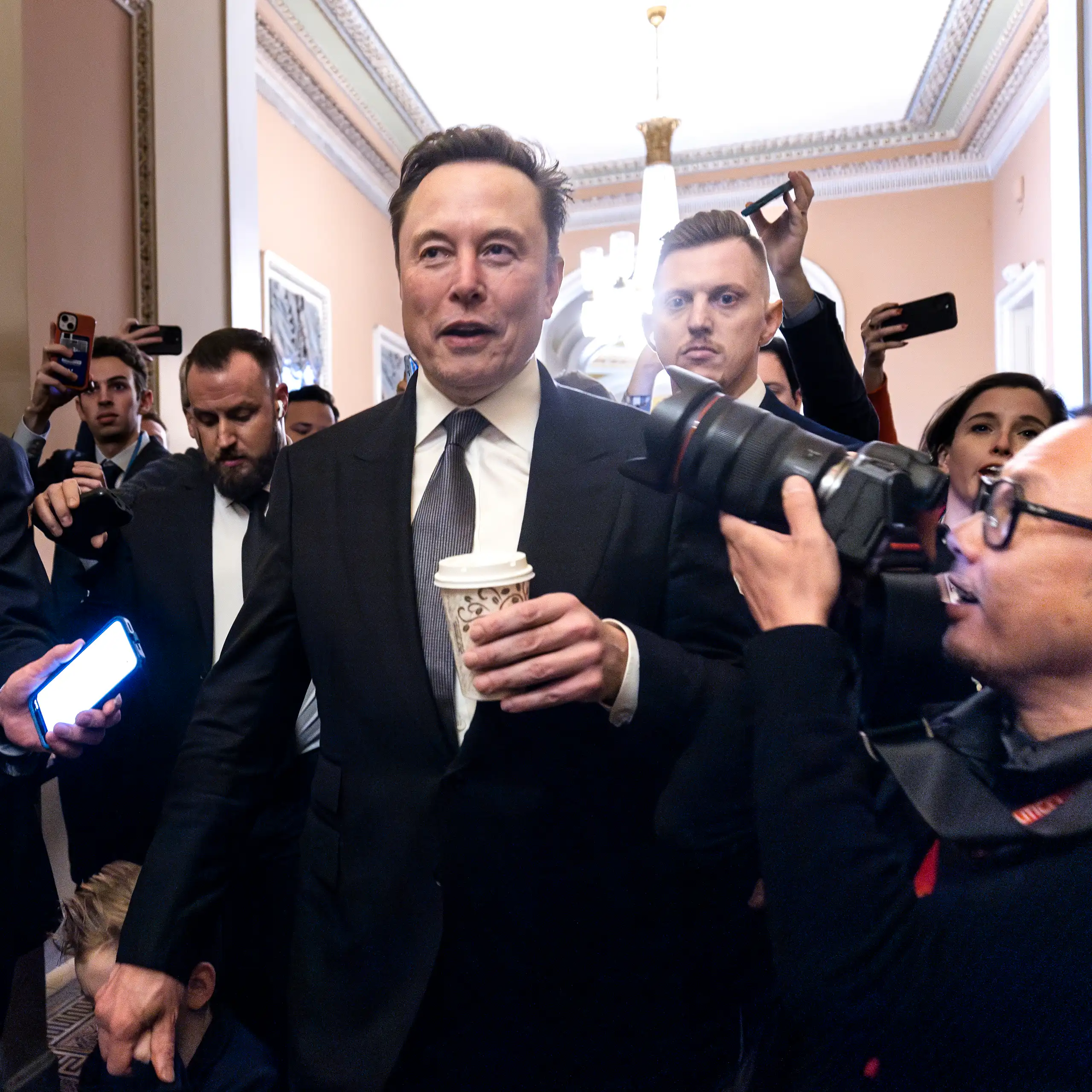 Elon Musk in front of reporters.