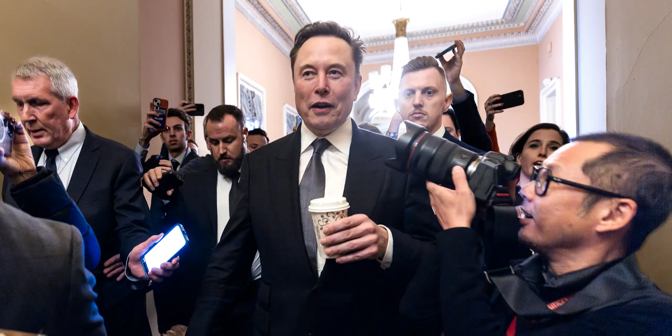 Elon Musk in front of reporters.