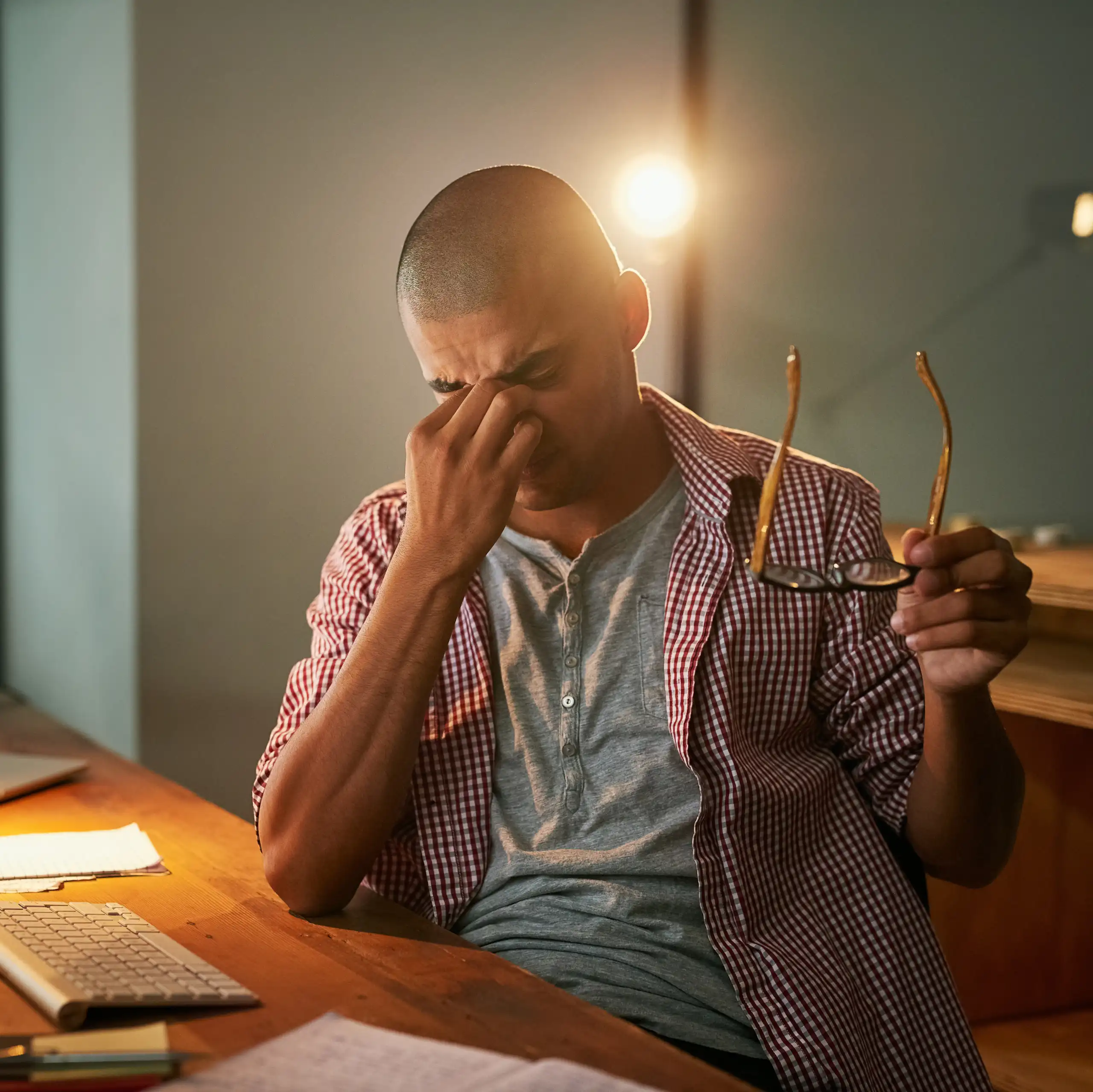 stressed man sitting at a computer
