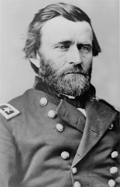 A black-and-white photo of a bearded man in a military uniform.