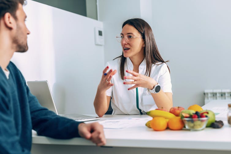 A dietitian with a patient