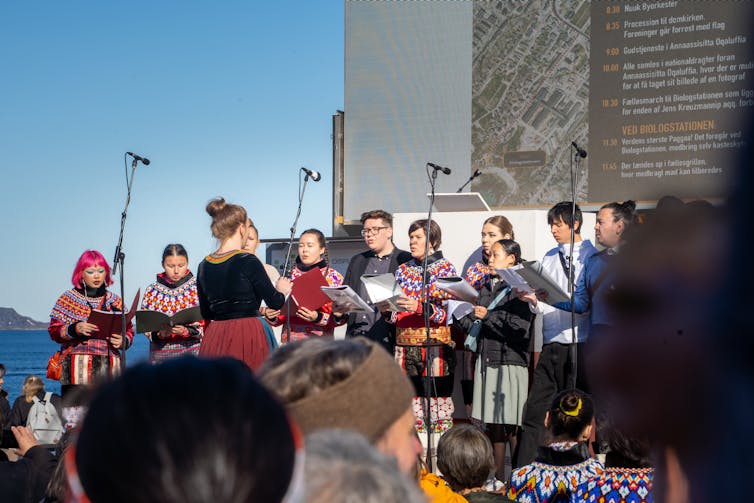 People seen singing as part of Greenland's National Day festival