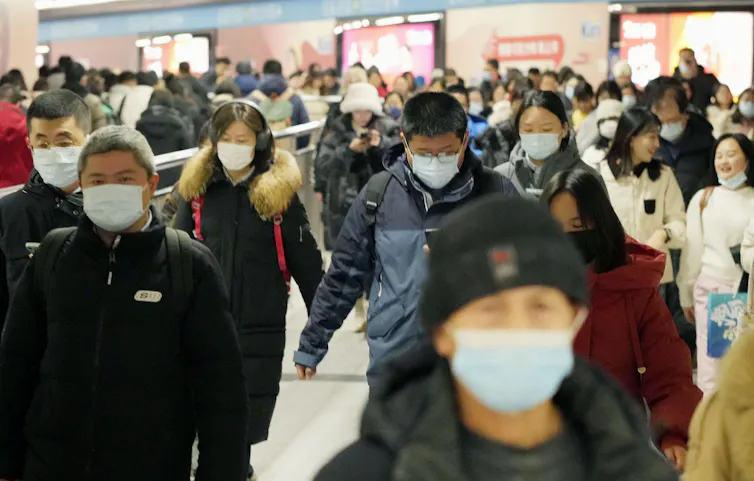 People in Beijing wearing masks.