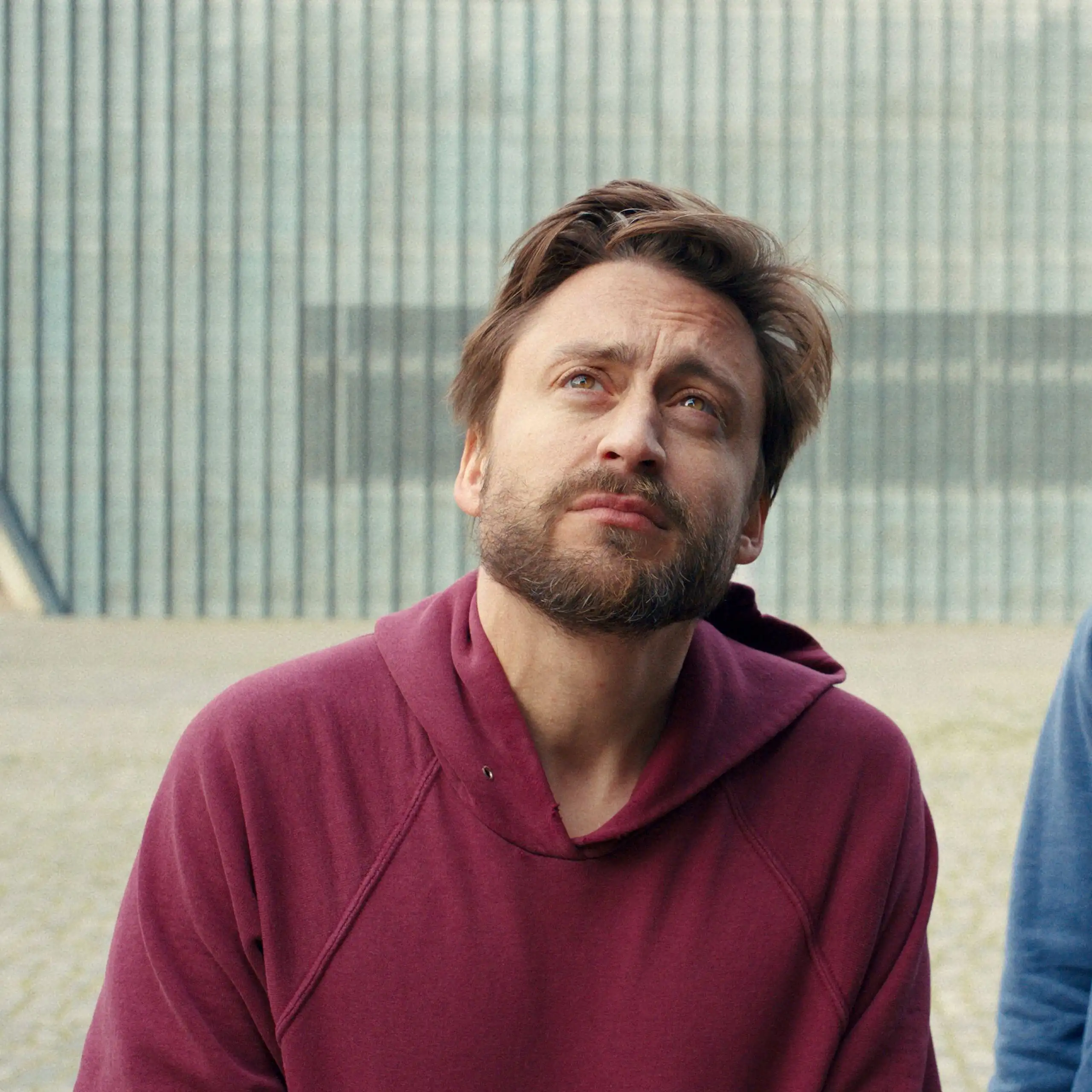 Kieran Culkin and Jesse Eisenberg looking to the sky