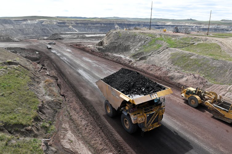 A giant truck loaded with coal is viewed at the Eagle Butte Coal Mine in 2017 in Gillette, Wyo.