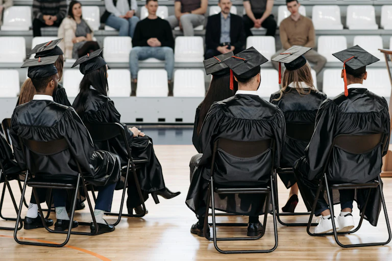 Graduates on a stage.